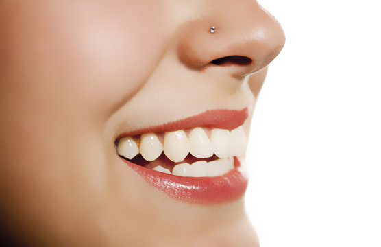 woman mouth smiling showing tooth