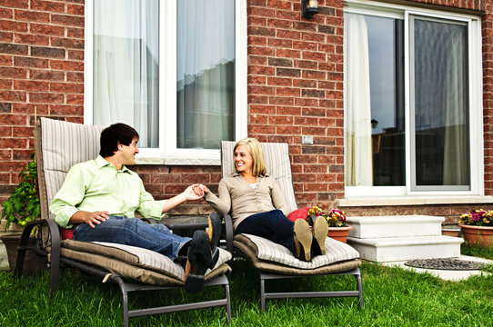 Happy couple relaxing at home - Powered by Adobe