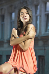 brunette in coral dress