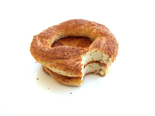 Bitten Turkish bagels with sesame isolated on white