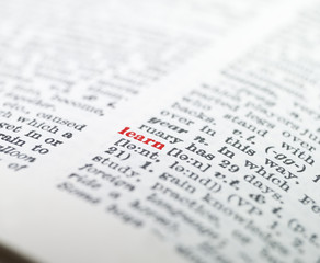Fototapeta premium The word 'learn' highlighted in a dictionary