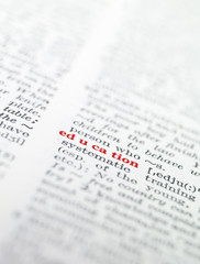 Fototapeta premium The word 'education' highlighted in a dictionary