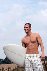 Surfer on the way to the beach