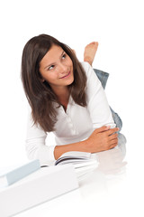 Smiling teenager with books