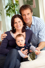 Couple with baby at home