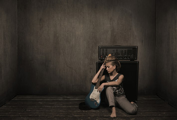 Girl with guitar in a vintage room