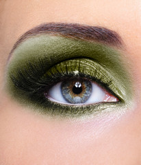 Make-up of woman eye with khaki eyeshadows