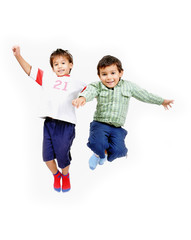 Very happy two little cute children jumping