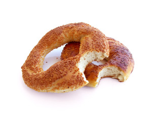 Bitten Turkish bagels with sesame isolated on white