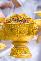 Dried flower petals in a golden bowl