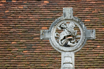st george and dragon against a tiled roof background