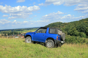Obraz na płótnie Canvas Off-road. 4x4 jeep at the top of a hill