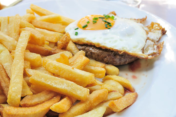 Egg and fries - classical english breakfast with egg and fries