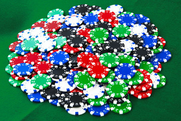 Casino chips on green felt