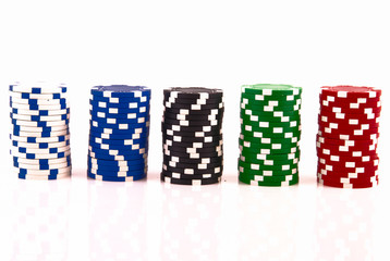 Fototapeta na wymiar Stacks of poker chips on white