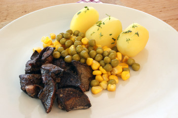 pork lung with potato and organic vegetable