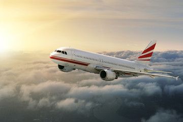 Fototapeta premium Samolot na niebie o zachodzie słońca