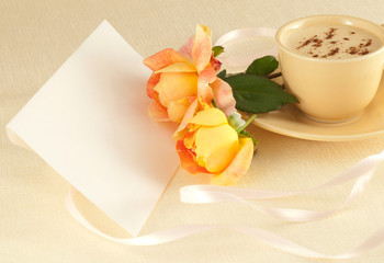 Cup of coffee , two roses and envelope