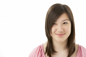 Fototapeta premium Studio Portrait of Smiling Teenage Girl