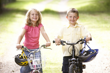 Fototapeta na wymiar Children riding bikes in countryside