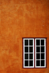 Fototapeta premium Orange wall and window
