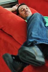 Obraz premium man relaxing on sofa