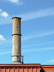 Crumbling concrete smokestack