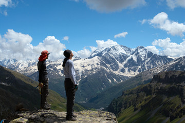Fototapeta na wymiar two climbers looking at the mountains