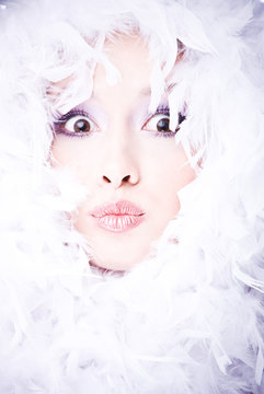 young woman with boa over her face (focus on lips)