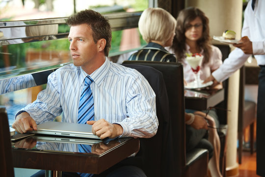 Businessman sitting in cafe