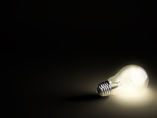 Luminous light bulb on black - 17041207