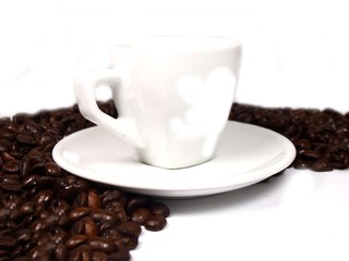 Cup of coffe on coffee beans background