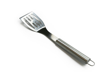 Spatule en inox sur fond blanc