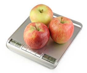 Three apples on kitchen scale