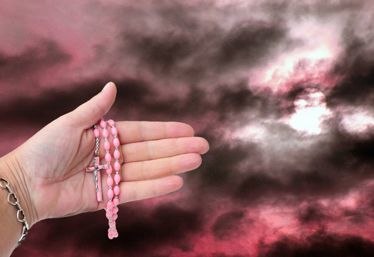 Rosary and heavenly sky