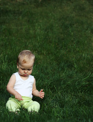 Liitle boy on a grass