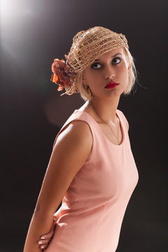 Portrait of beautiful retro-style woman in bonnet