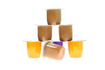 Several mugs with dessert put in pyramid