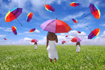 Woman Standing in a Field Holding an Umbrella