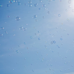 bubbles on pale blue sky background