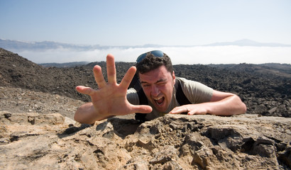 Man climbing a mountain