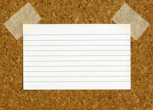 Blank Index Card Stick To A Cork Notice Board.