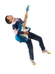 Child jumping with a guitar