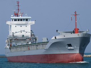 A huge ship heading for a port