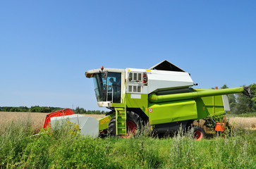 Combine harvester at work in the fields.