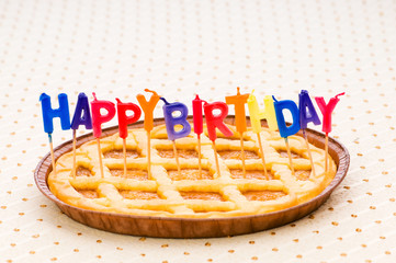 Happy birthday candles in the pie