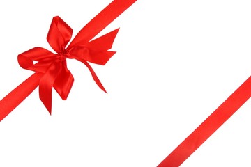 Red holiday ribbon and bow on white background
