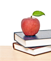 Red apple on  books