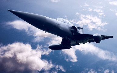 Fototapeta na wymiar Military airplane on the blue sky