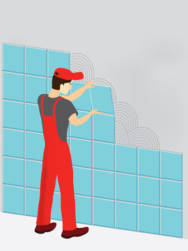 Construction worker in red suit laying tiles